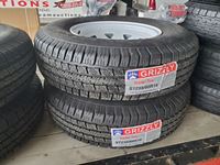    (4) 235/80R16 Grizzly Trailer Tires and Rim