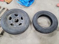    (1) 225/70R19.5 Tire and (1) 275/70R18 Tire on Rim
