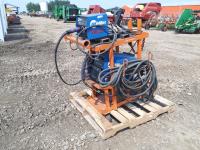 Miller Welder and Wire Feeder Setup with Cables