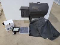 Traeger Smoker Grill and LED Rechargeable Flood Light with Solar Panel