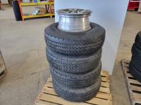 (4) Michelin XPS Rib LT235/85R16 Tires On Nissan Aluminum Rims, Hub Caps and Spare Rim 