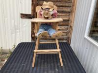 Doll Sitting On a Highchair 